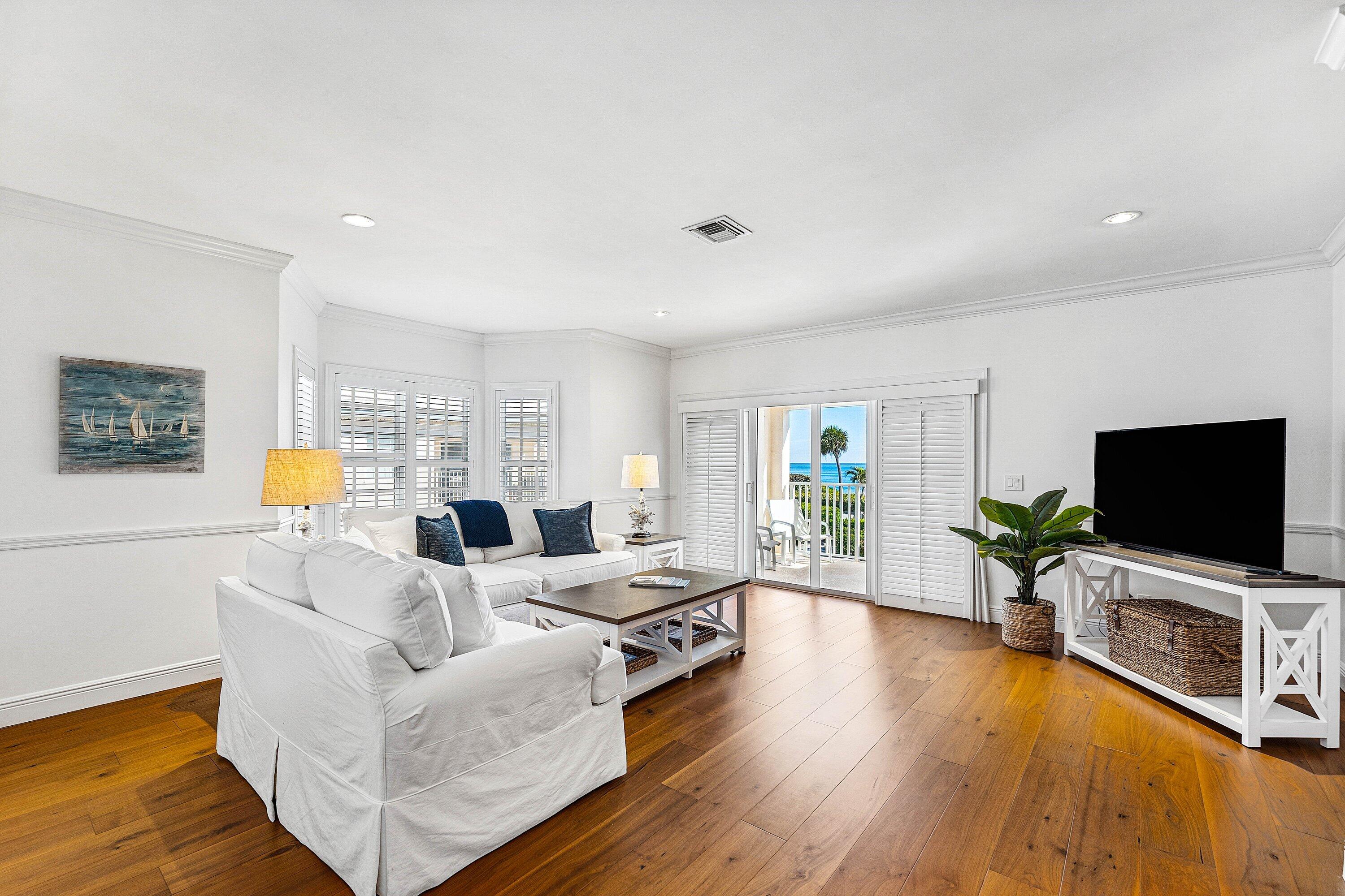 5900 Old Ocean Boulevard, Unit C4 Ocean Ridge, FL 33435 - Photo 14 of 25 a living room with furniture flat screen tv and wooden floor