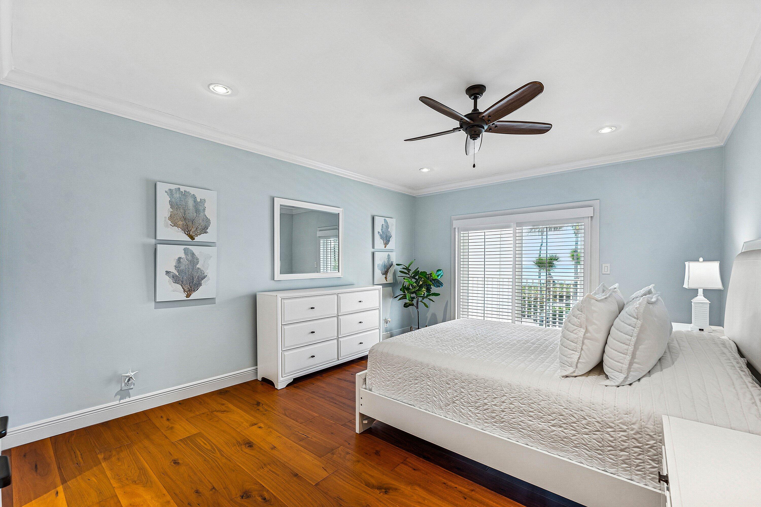 5900 Old Ocean Boulevard, Unit C4 Ocean Ridge, FL 33435 - Photo 18 of 25 a bedroom with a bed dresser and window