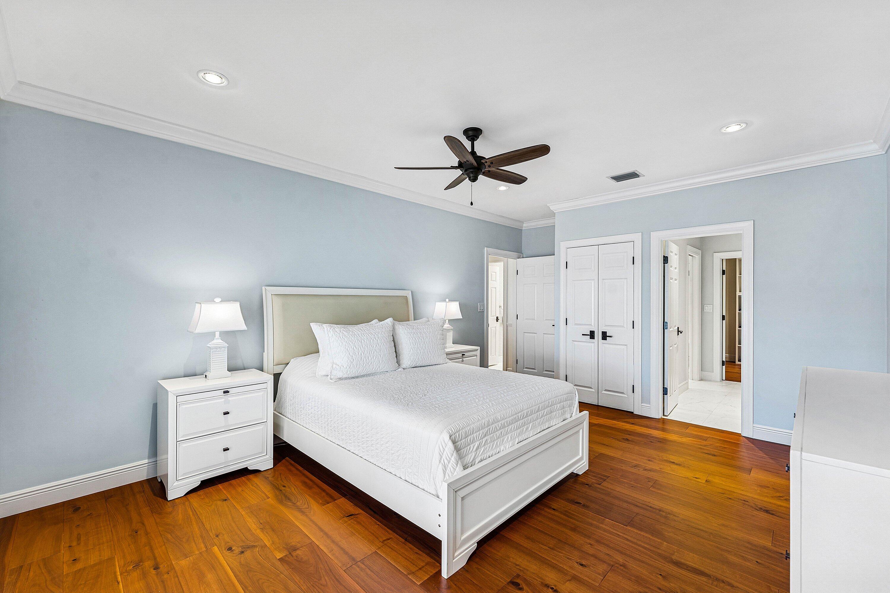 5900 Old Ocean Boulevard, Unit C4 Ocean Ridge, FL 33435 - Photo 19 of 25 a bedroom with a large bed and a chandelier