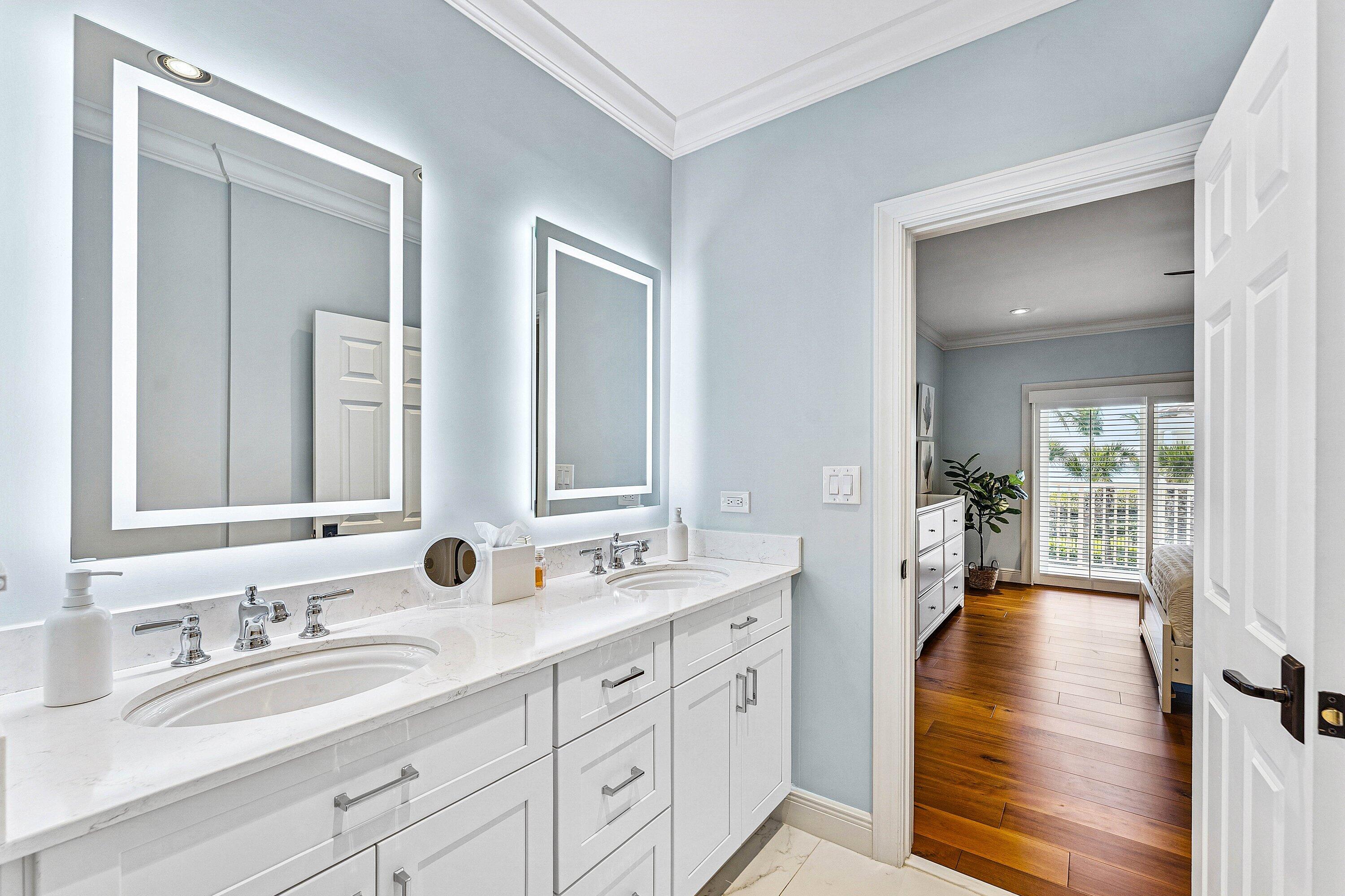 5900 Old Ocean Boulevard, Unit C4 Ocean Ridge, FL 33435 - Photo 20 of 25 a en suite bathroom with double sink and a large mirror