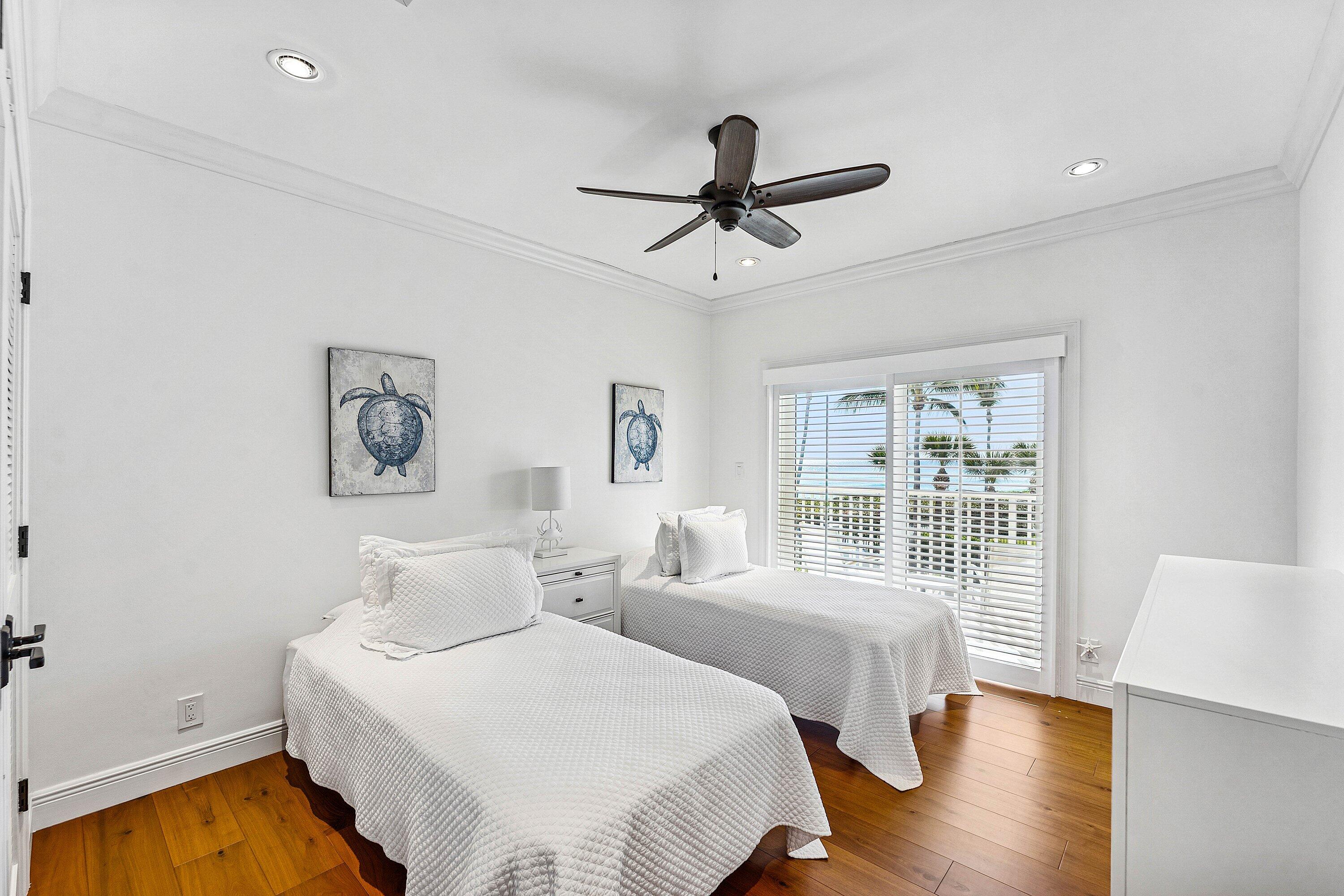5900 Old Ocean Boulevard, Unit C4 Ocean Ridge, FL 33435 - Photo 23 of 25 a bedroom with two beds and a large window