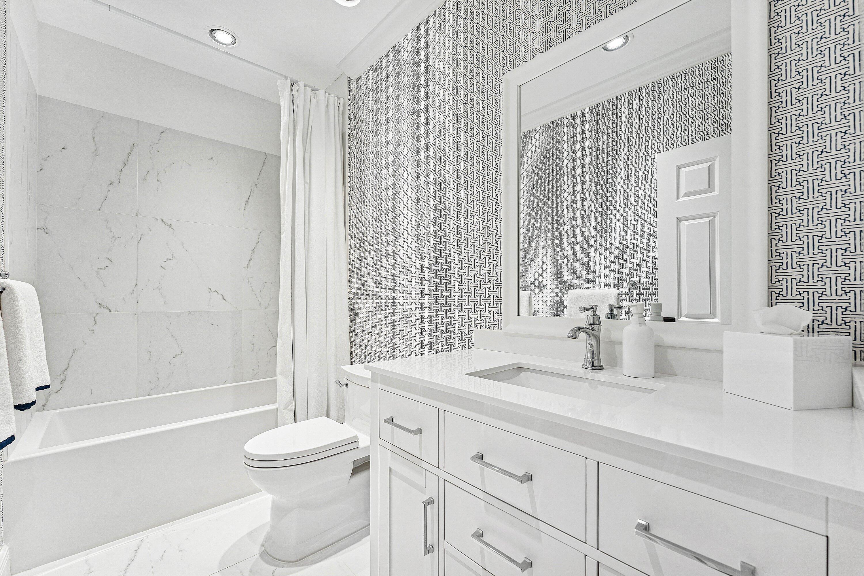 5900 Old Ocean Boulevard, Unit C4 Ocean Ridge, FL 33435 - Photo 24 of 25 a bathroom with a sink a toilet and shower