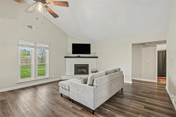 a living room with furniture and a fireplace