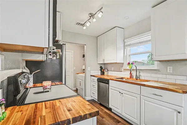 a kitchen with a sink and cabinets