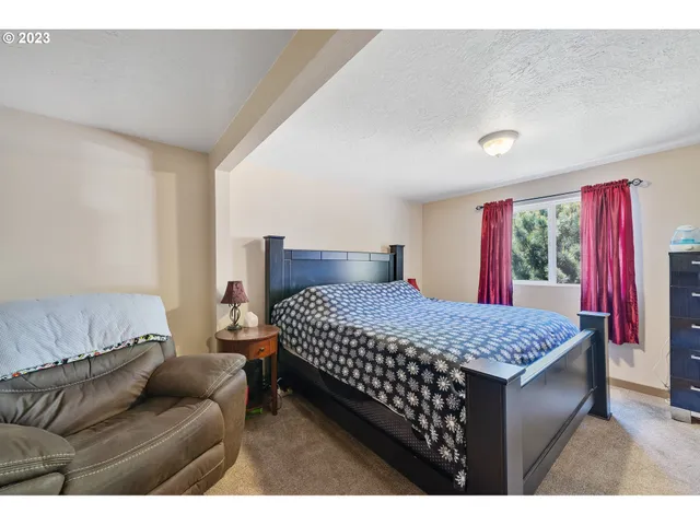 a view of walk in closet with clothes