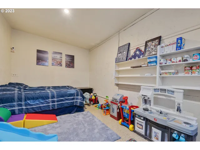 a kitchen with stainless steel appliances a sink a stove and a refrigerator