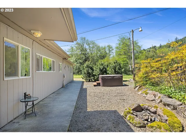 a open kitchen with refrigerator stove dining table and chairs