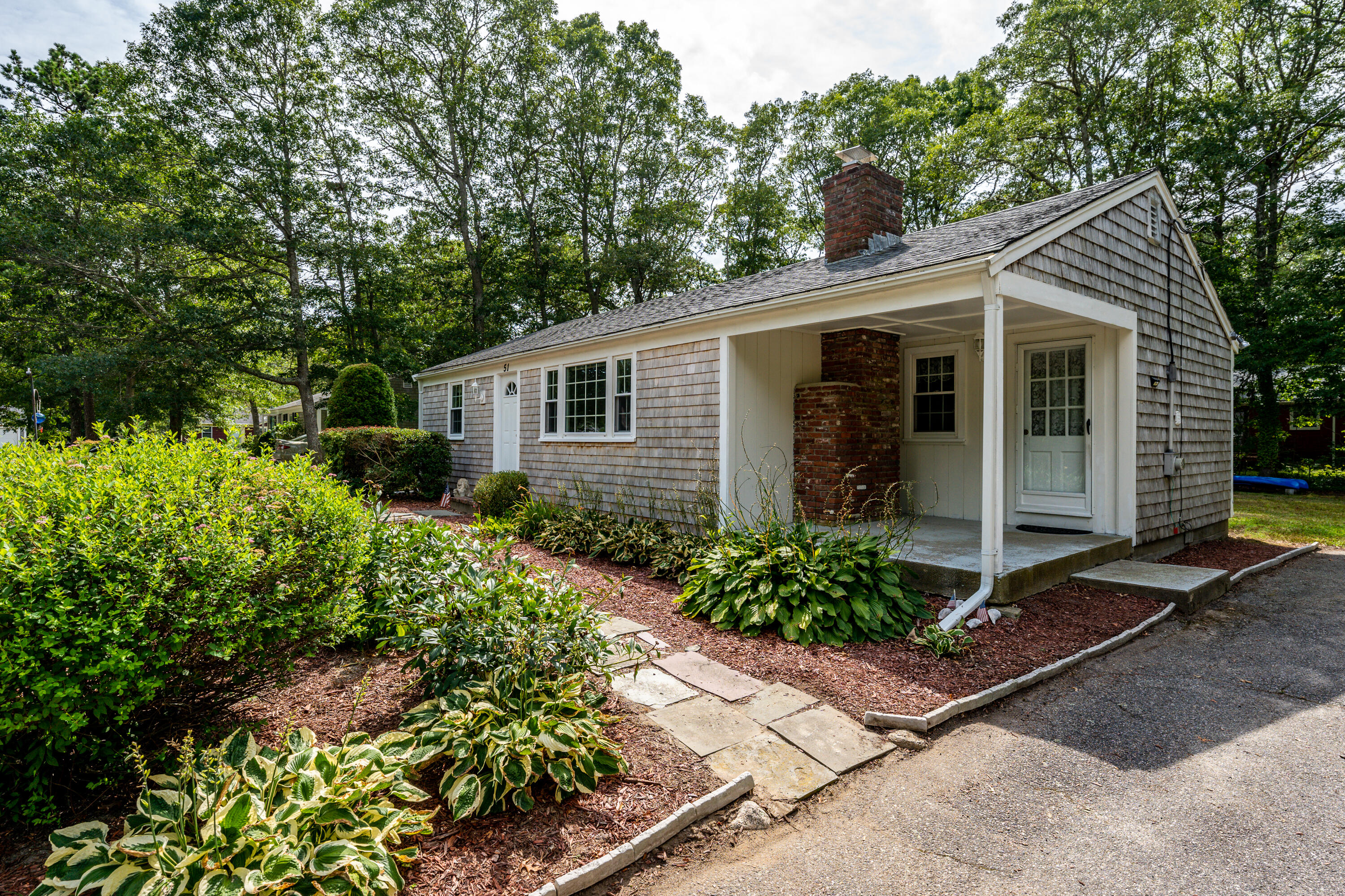 51 Pram Road Hyannis, MA 02601 - Photo 1 of 12 a view of a house with potted plants
