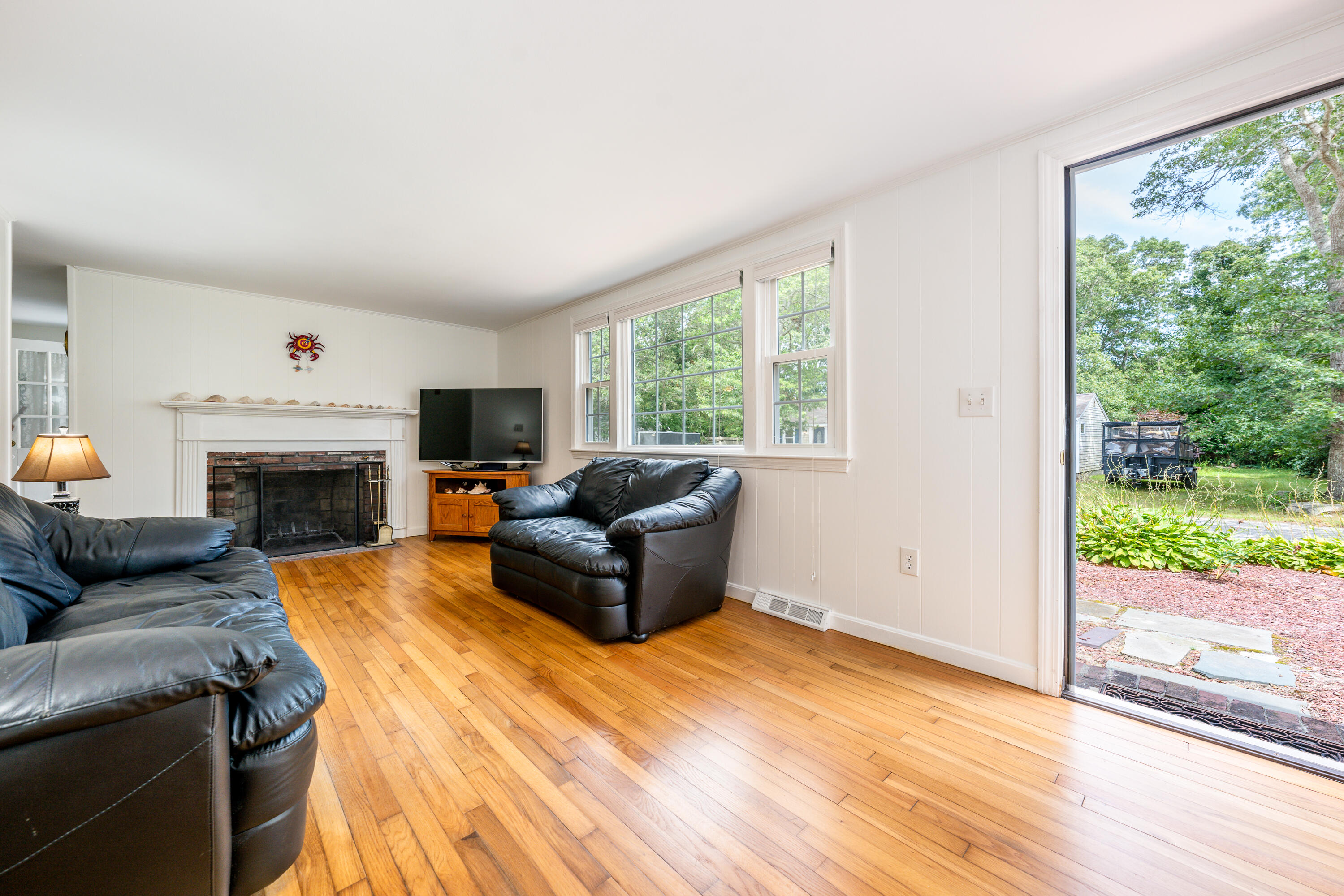 51 Pram Road Hyannis, MA 02601 - Photo 7 of 12 a living room with furniture and a fireplace