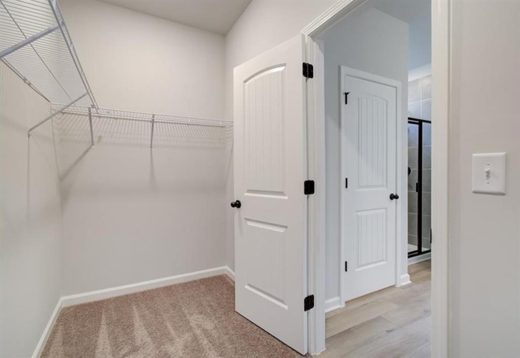123 St Anne's Place Covington, GA 30016 - Photo 21 of 21 a view of a hallway with wooden floor