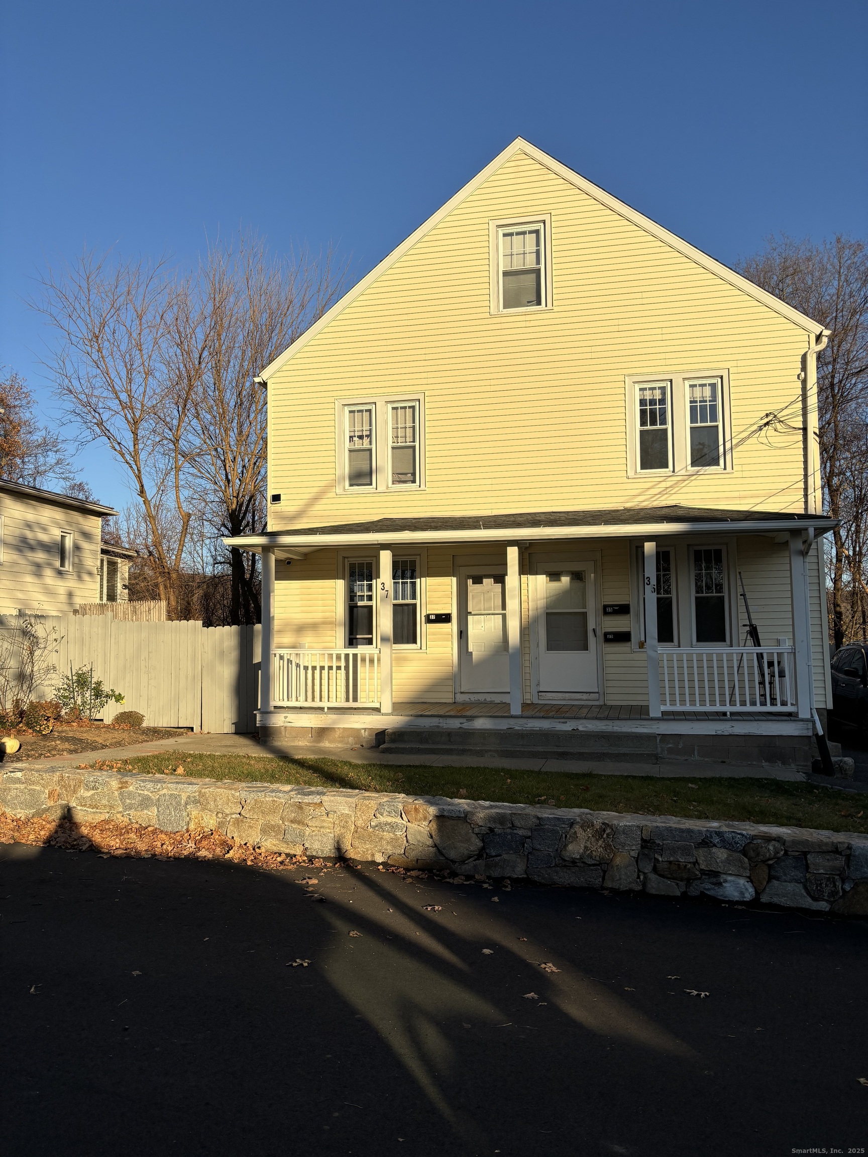 35 Washington Street Naugatuck, CT 06770 - Photo 1 of 16 a front view of a house with a yard