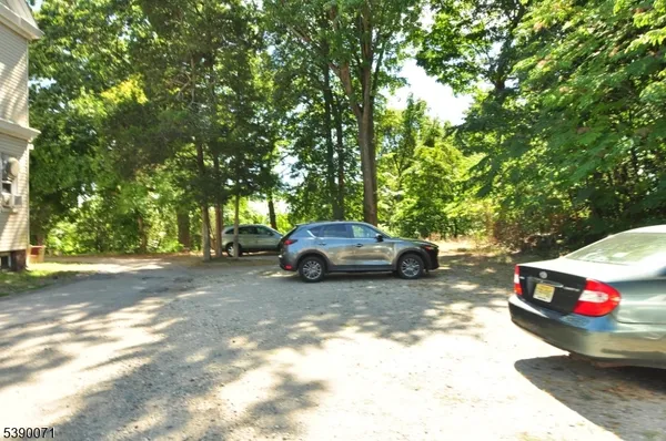a view of a car parked in front of a house