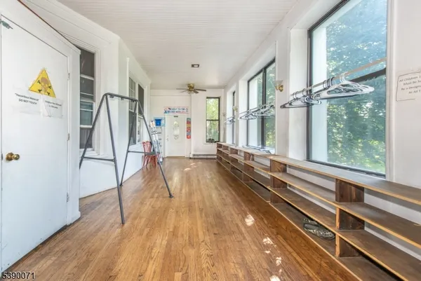 a view of gallery with wooden floor