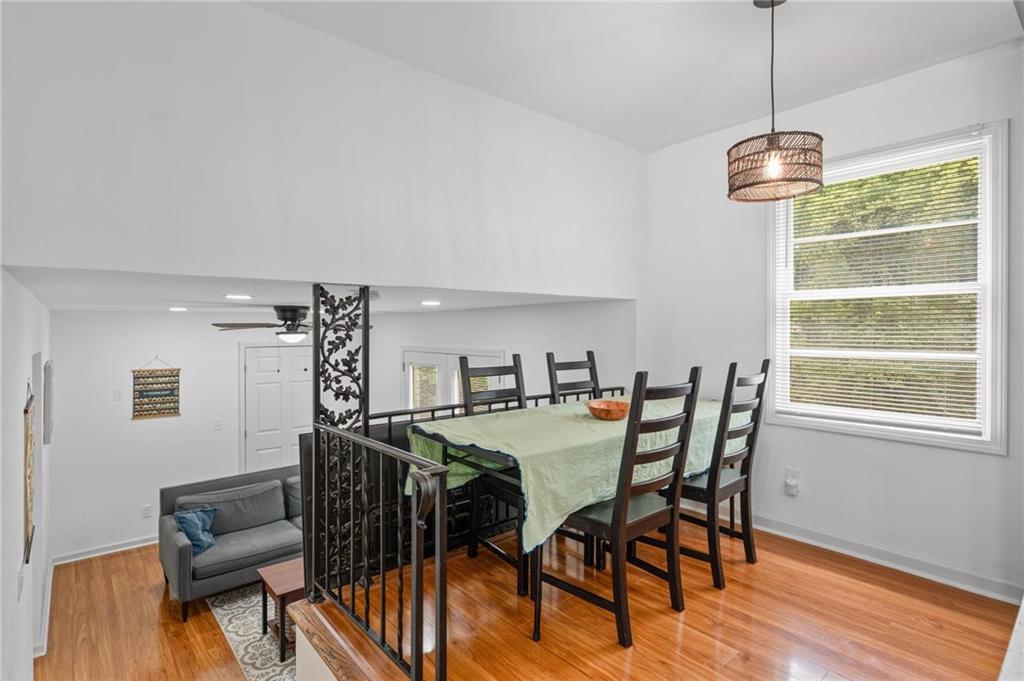 799 Pine Roc Drive Stone Mountain, GA 30083 - Photo 11 of 26 a view of a dining room with furniture window and wooden floor