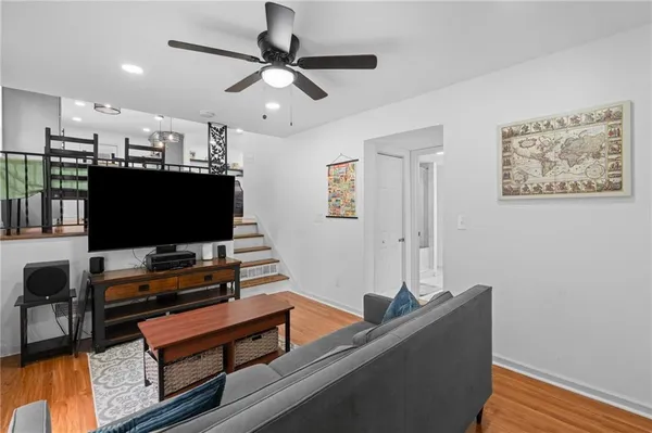 a room with furniture and a flat screen tv