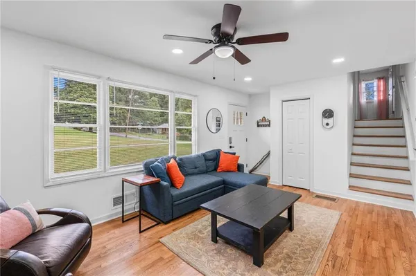 a living room with furniture and a window
