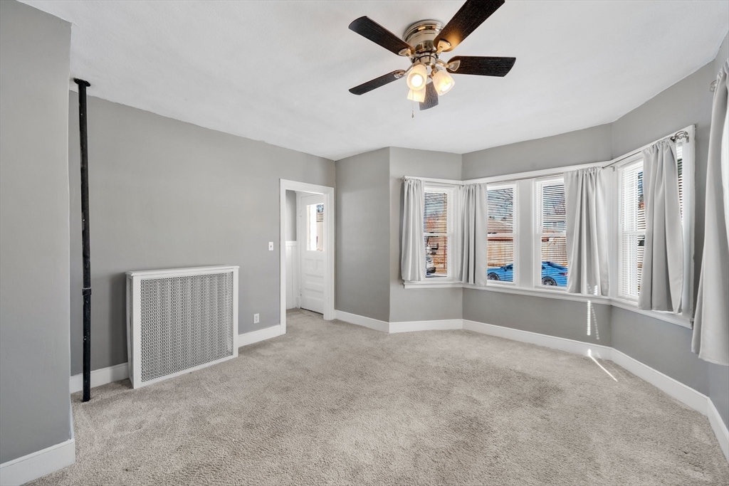 41 Briggs Street Springfield, MA 01151 - Photo 13 of 30 a view of an empty room with a window