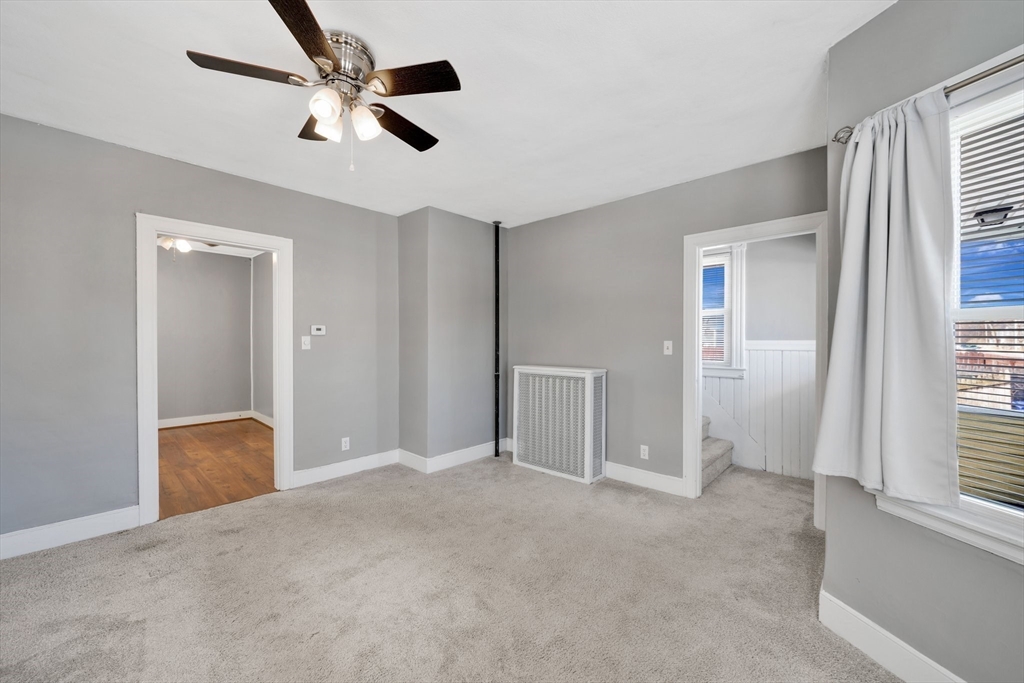 41 Briggs Street Springfield, MA 01151 - Photo 14 of 30 a view of empty room with ceiling fan