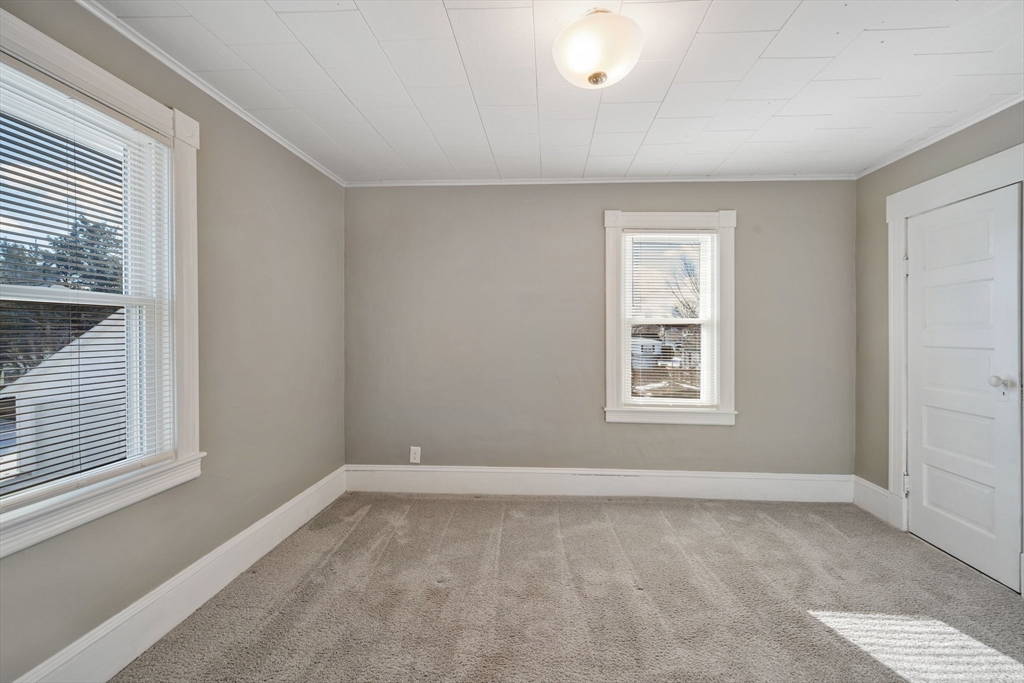 41 Briggs Street Springfield, MA 01151 - Photo 17 of 30 a view of a room that has a window in it