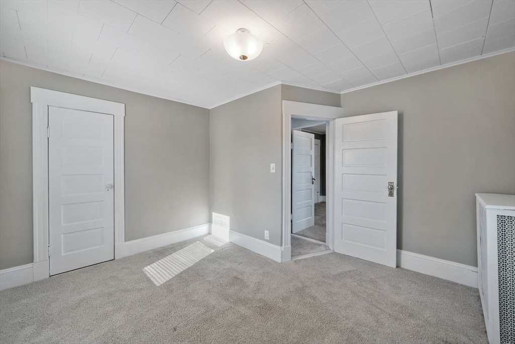 41 Briggs Street Springfield, MA 01151 - Photo 18 of 30 an empty room with closet and windows