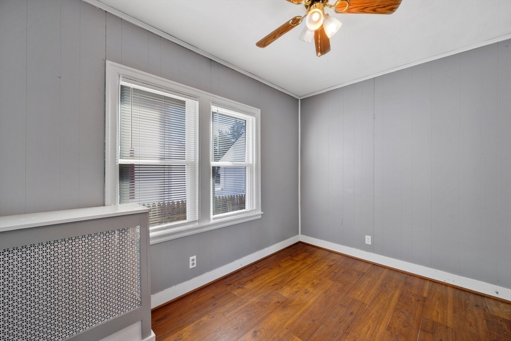 41 Briggs Street Springfield, MA 01151 - Photo 10 of 30 a view of empty room with wooden floor and fan