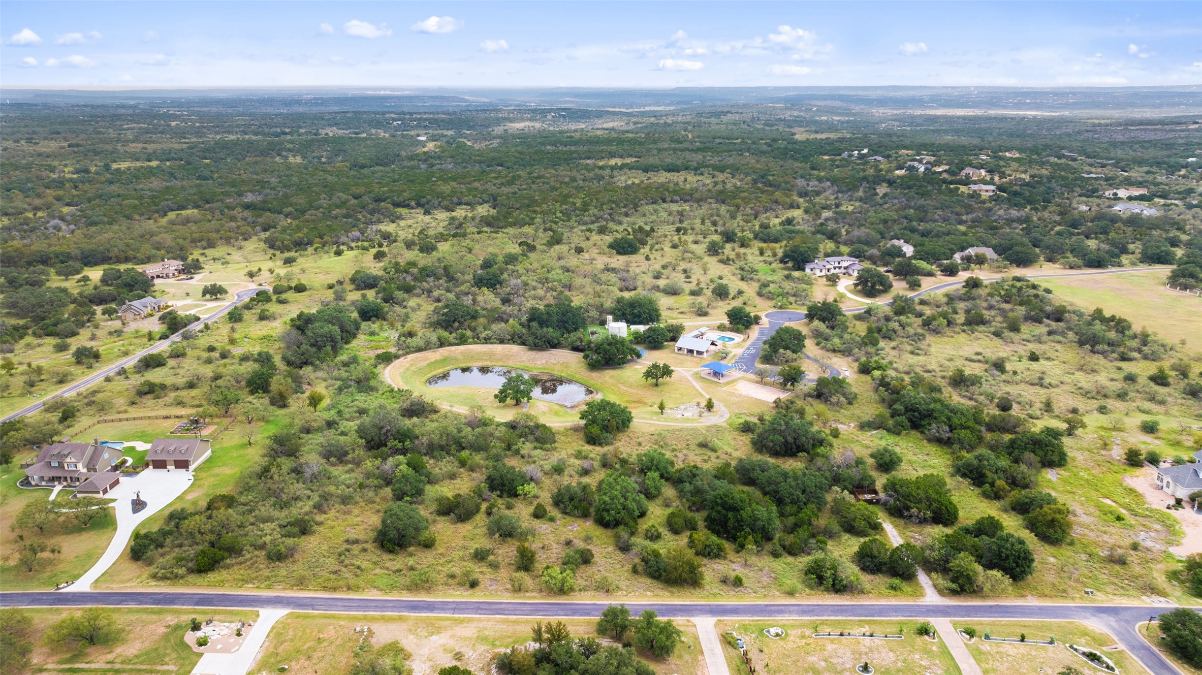 108 Cross Trail Spicewood, TX 78669 - Photo 13 of 33 a view of a city from a yard