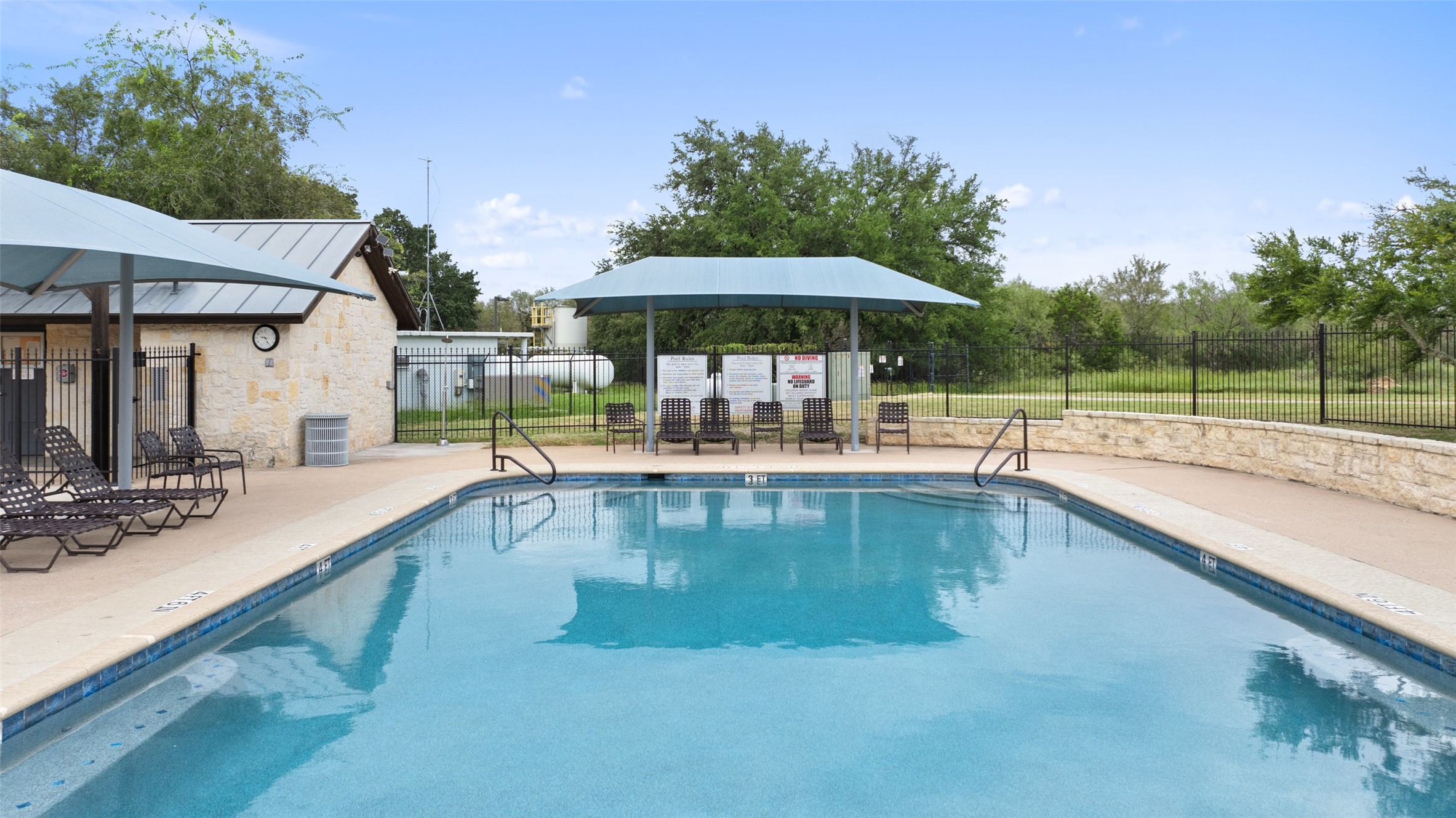 108 Cross Trail Spicewood, TX 78669 - Photo 20 of 33 a swimming pool with outdoor seating yard and barbeque oven