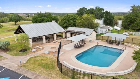 an aerial view of a house with garden space and street view