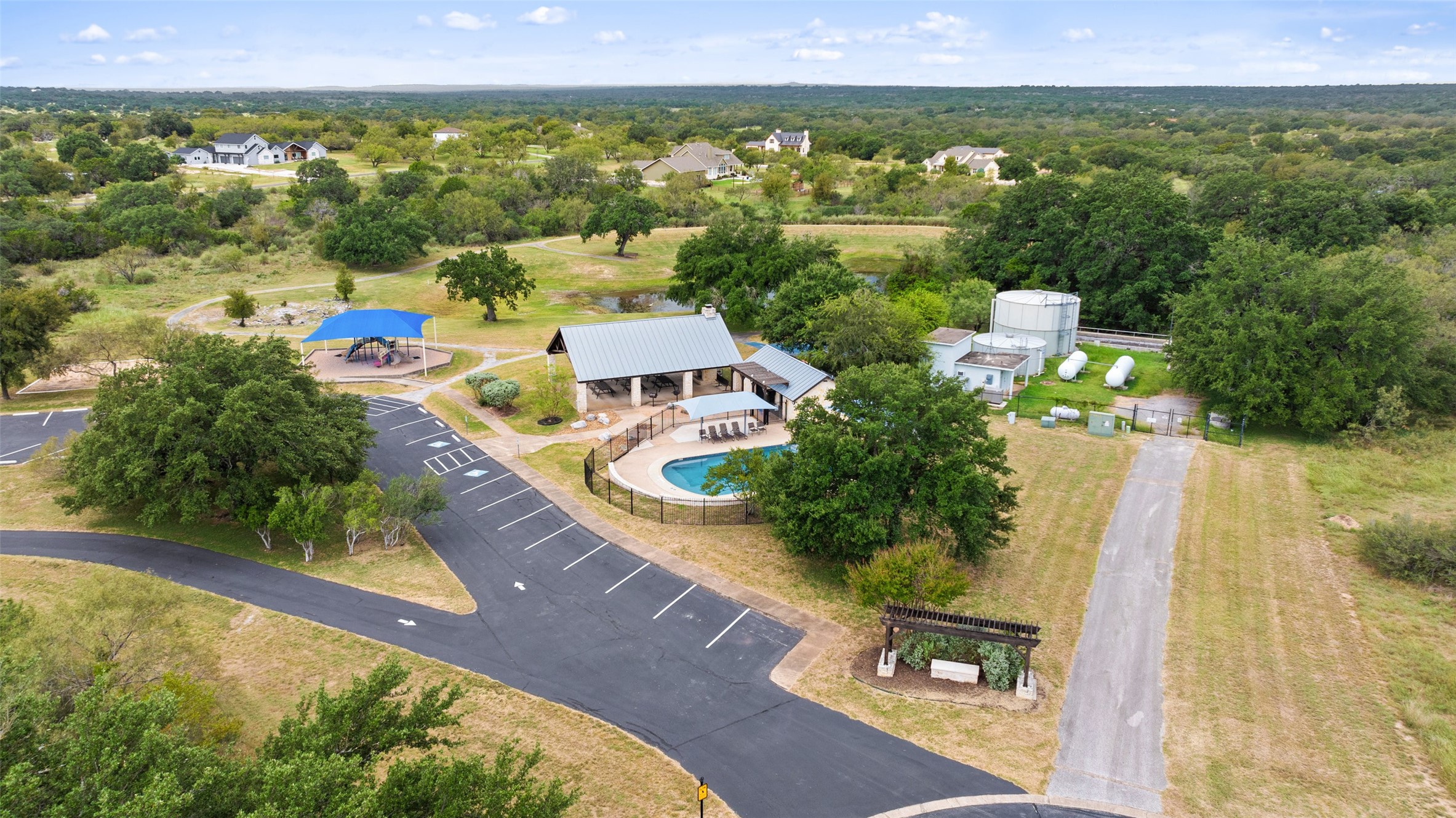 108 Cross Trail Spicewood, TX 78669 - Photo 25 of 33 a view of a swimming pool with a yard