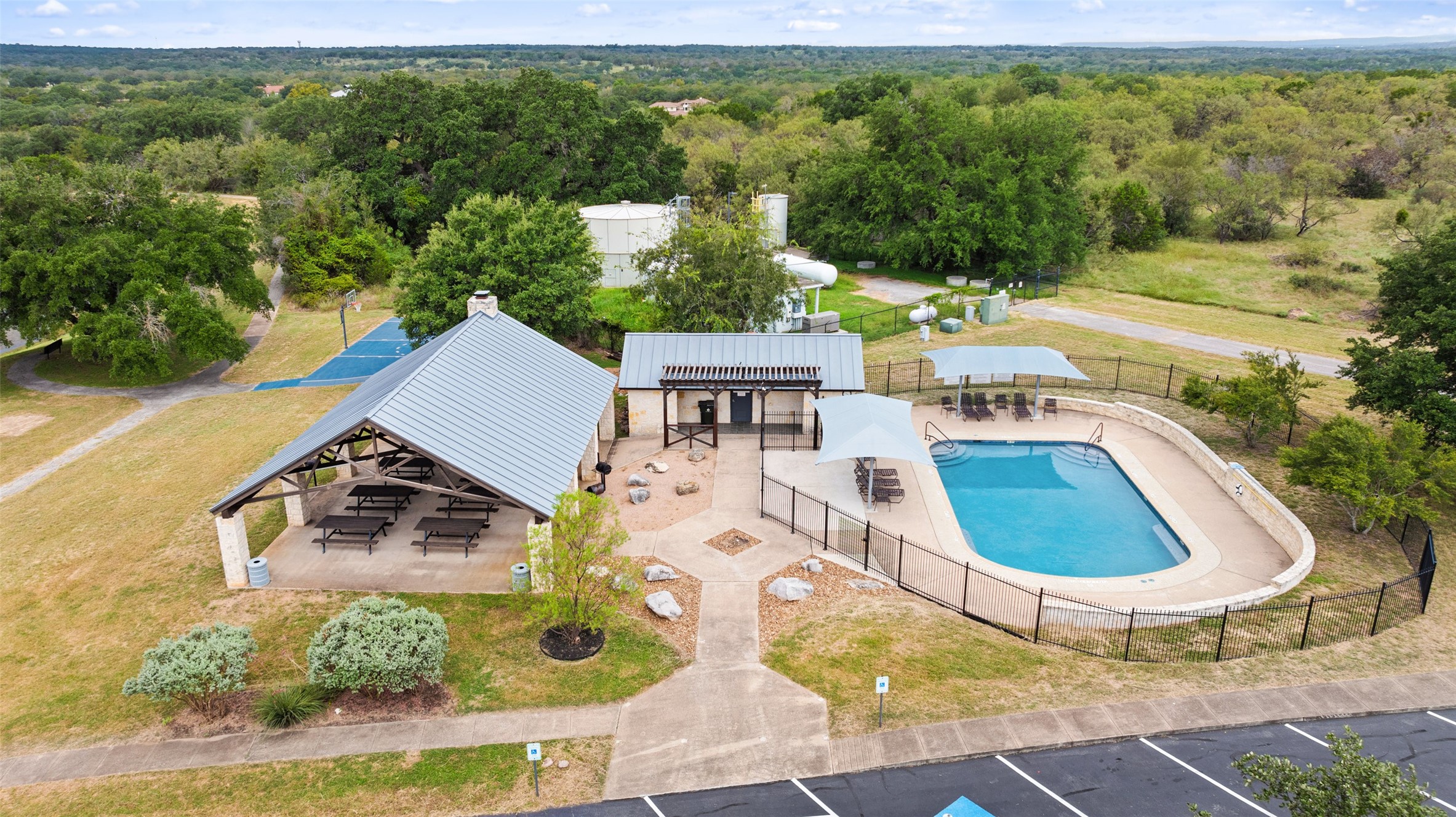 108 Cross Trail Spicewood, TX 78669 - Photo 26 of 33 an aerial view of a house with garden space and street view