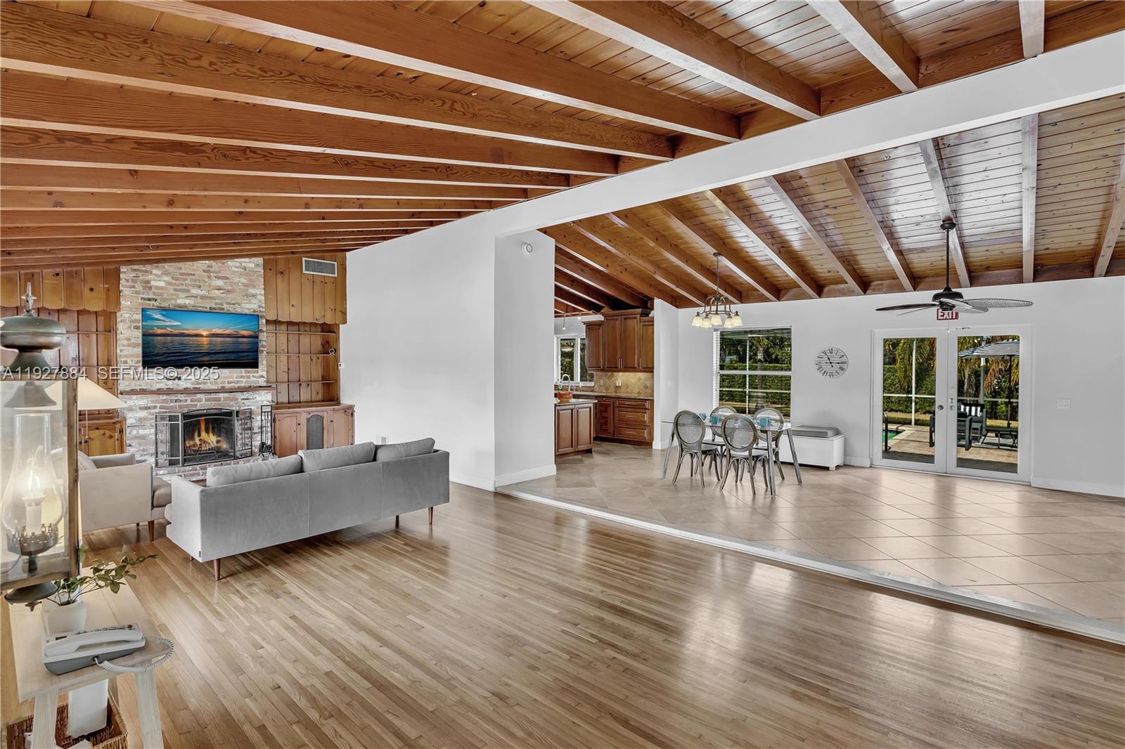 a living room with furniture and flat screen tv