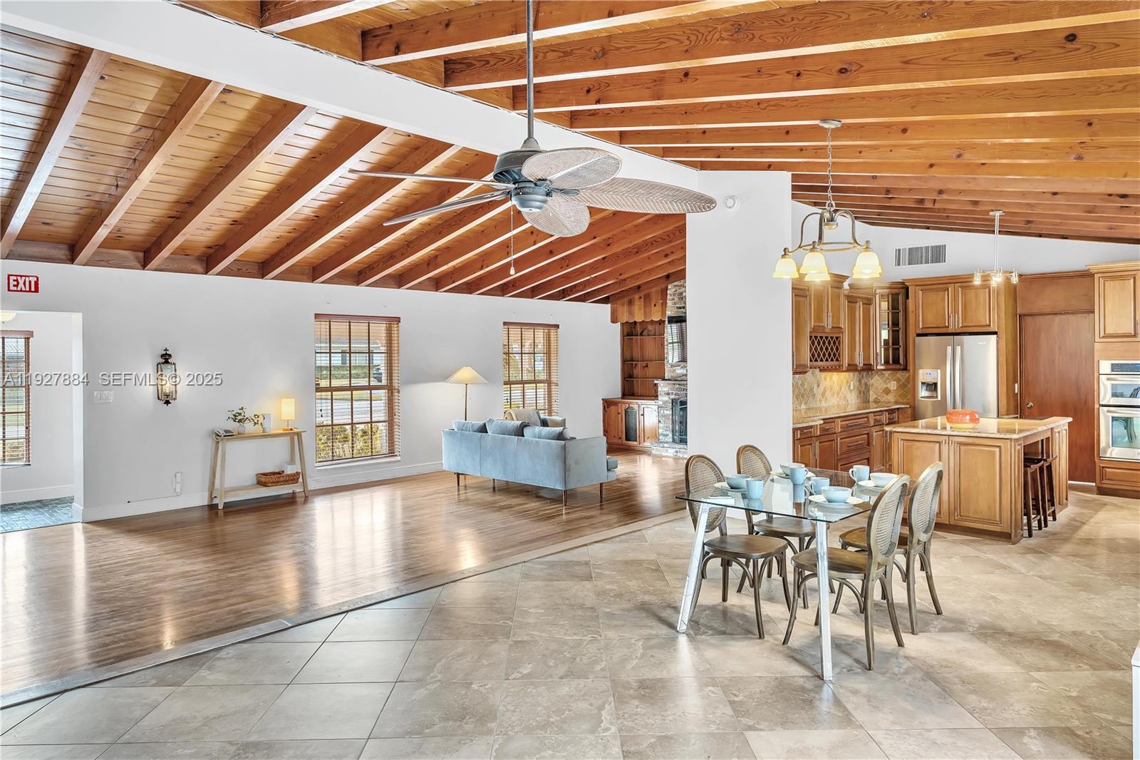 3437 Buchanan Street Hollywood, FL 33021 - Photo 13 of 40 a view of a dining area with furniture and a window