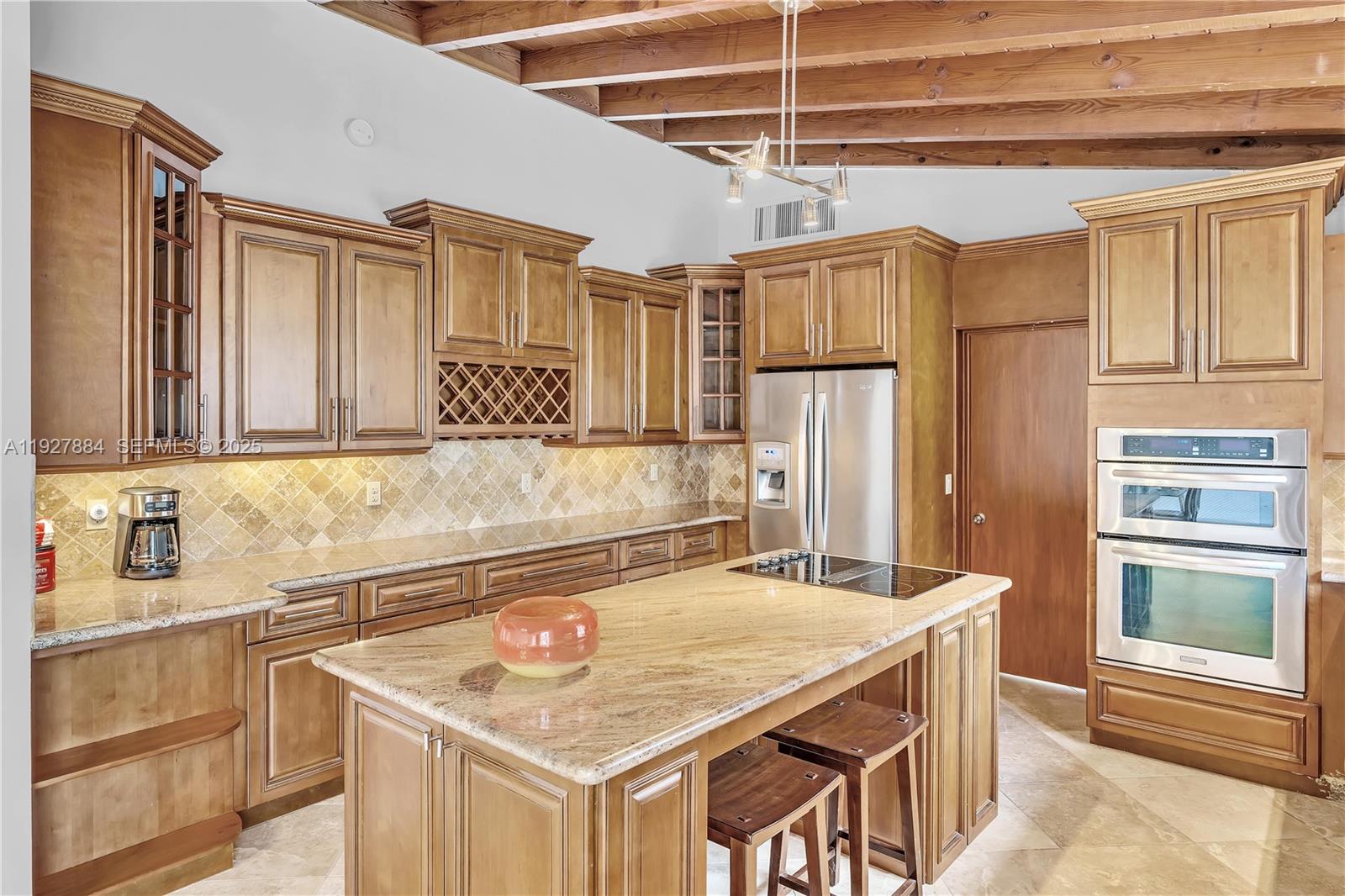 3437 Buchanan Street Hollywood, FL 33021 - Photo 17 of 40 a kitchen with stainless steel appliances granite countertop a sink refrigerator and cabinets