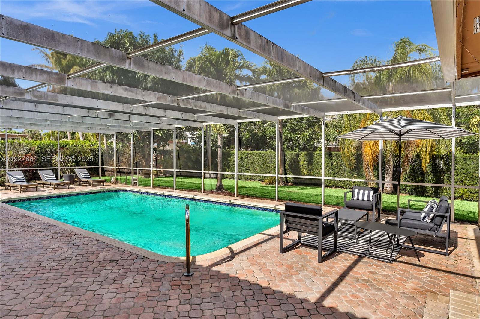 3437 Buchanan Street Hollywood, FL 33021 - Photo 22 of 40 a view of a swimming pool with a patio and a backyard