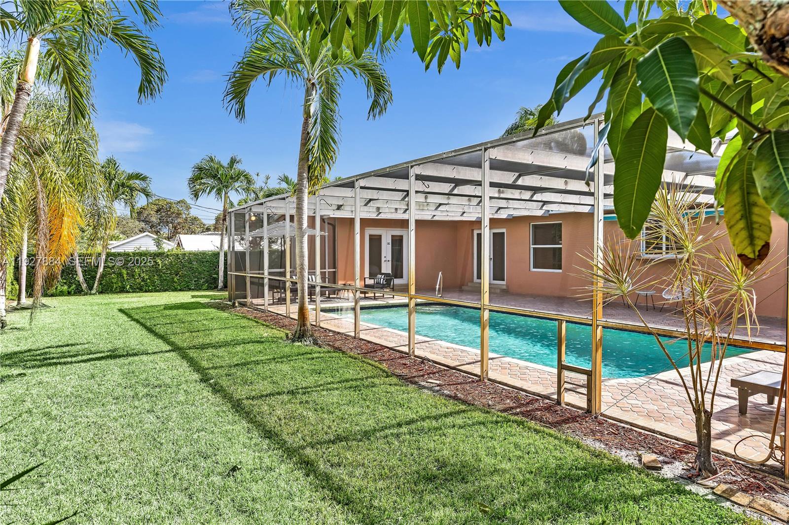3437 Buchanan Street Hollywood, FL 33021 - Photo 29 of 40 a view of a house with backyard and a tree