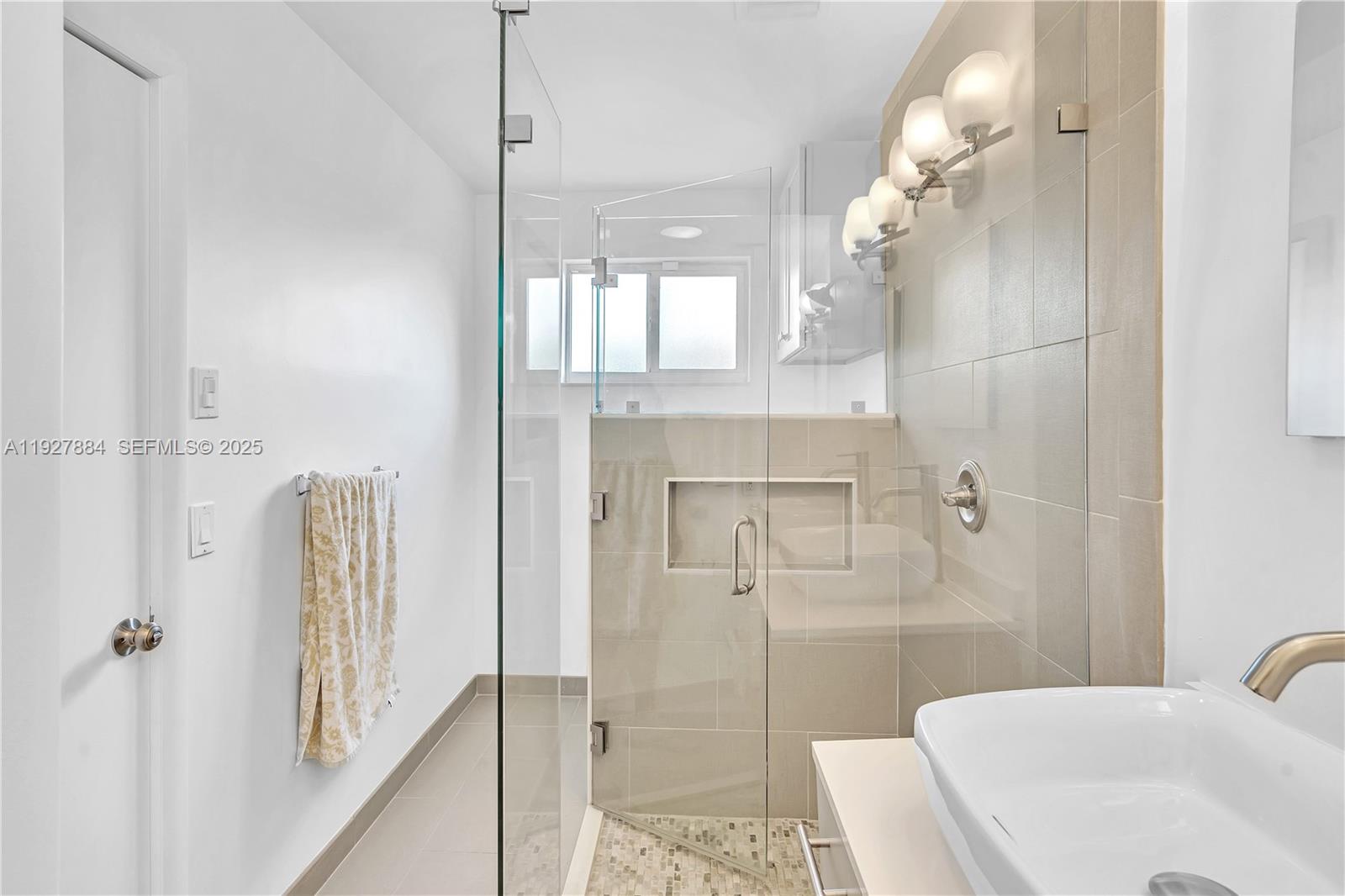 3437 Buchanan Street Hollywood, FL 33021 - Photo 33 of 40 a bathroom with a sink a toilet and shower