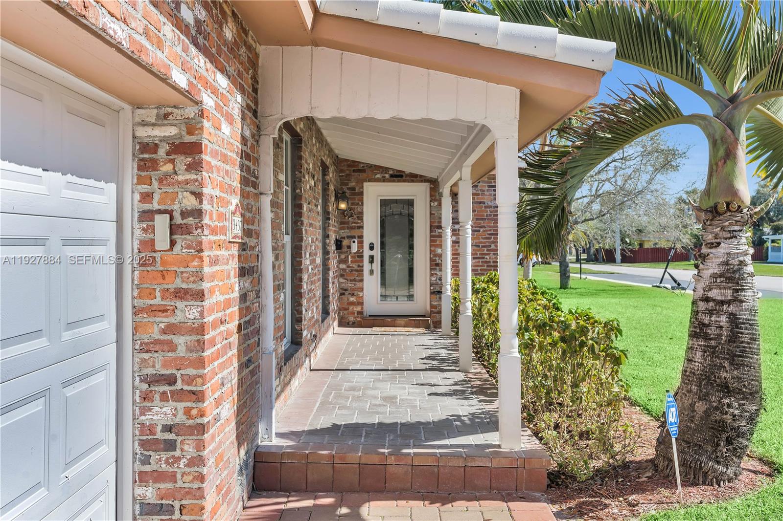 3437 Buchanan Street Hollywood, FL 33021 - Photo 36 of 40 a front view of a house with a garden