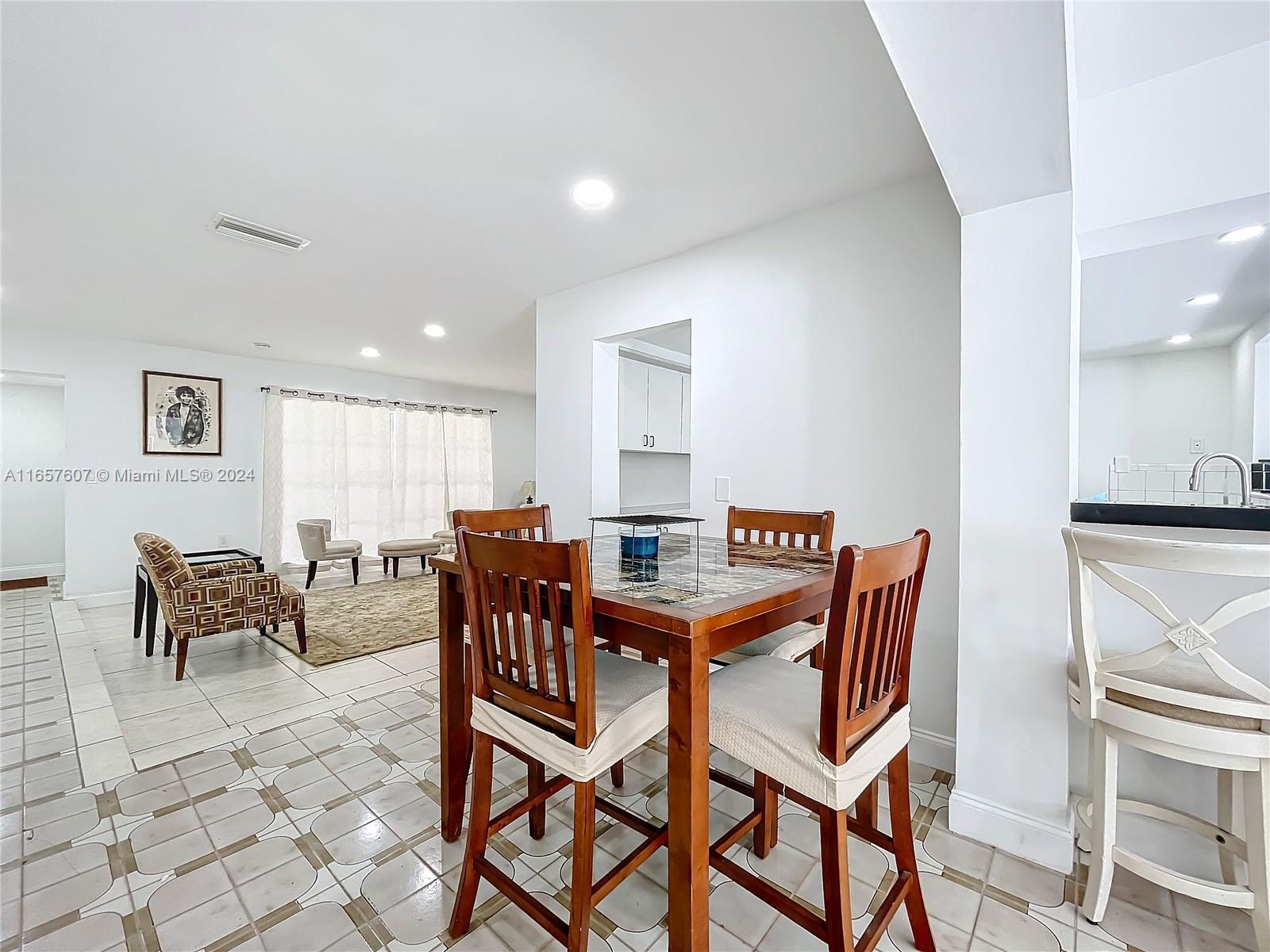 8218 Southampton Drive Miramar, FL 33025 - Photo 13 of 28 a view of a dining room with furniture