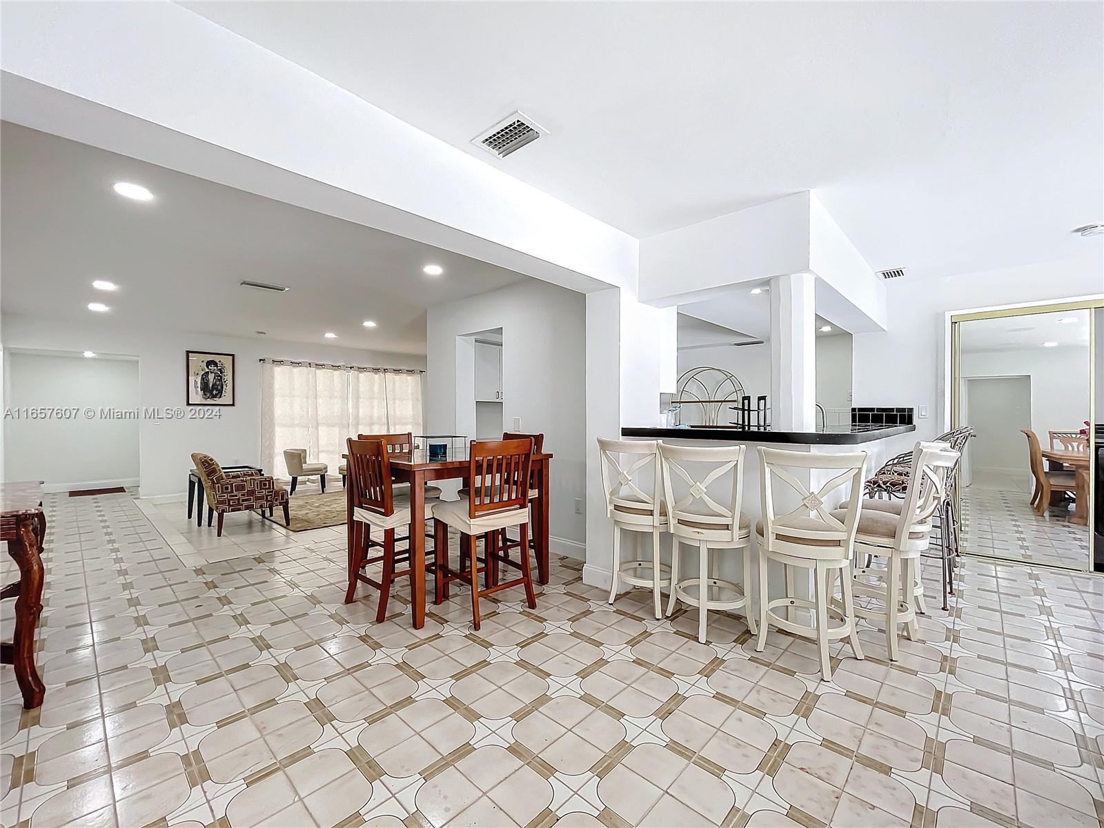 8218 Southampton Drive Miramar, FL 33025 - Photo 14 of 28 a view of a dining room with furniture