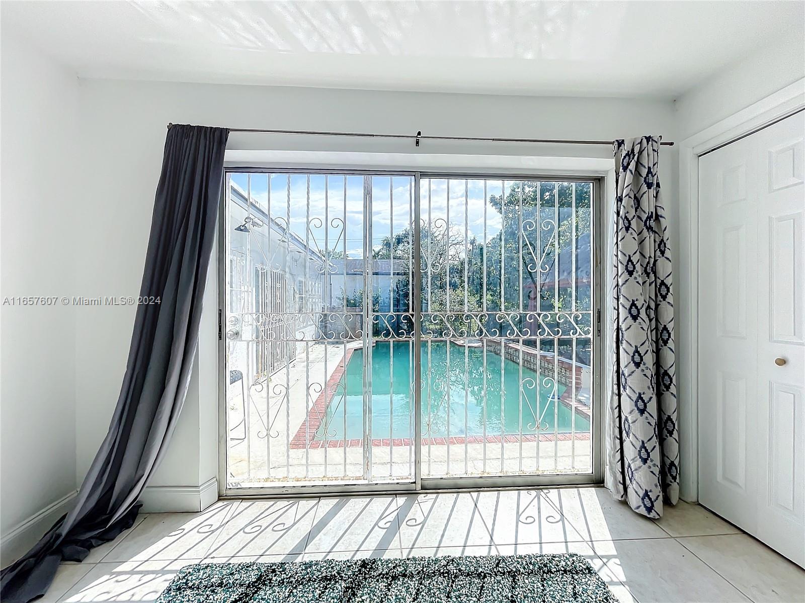 8218 Southampton Drive Miramar, FL 33025 - Photo 18 of 28 a view of porch with a floor to ceiling window