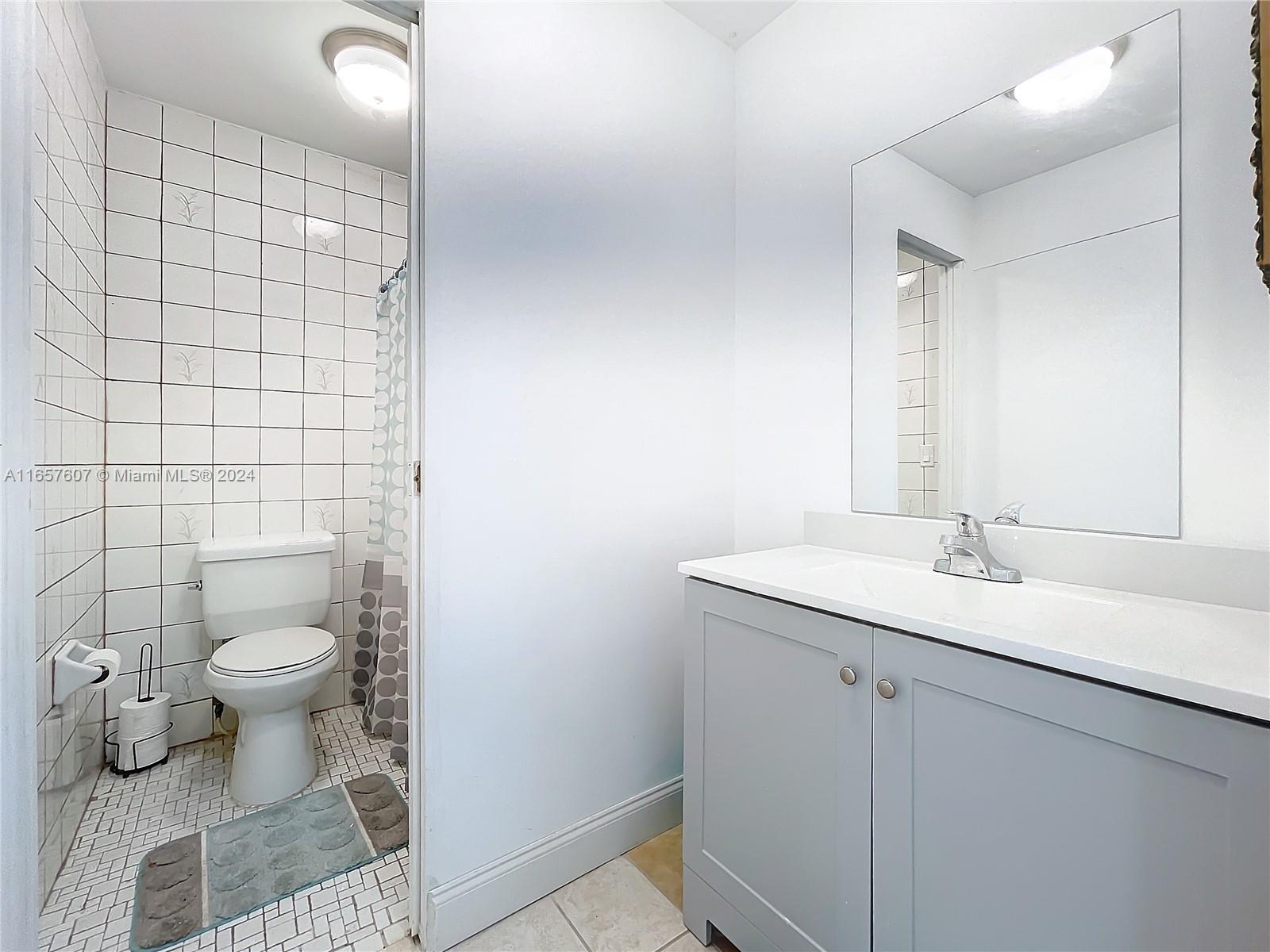 8218 Southampton Drive Miramar, FL 33025 - Photo 19 of 28 a bathroom with a sink and a toilet