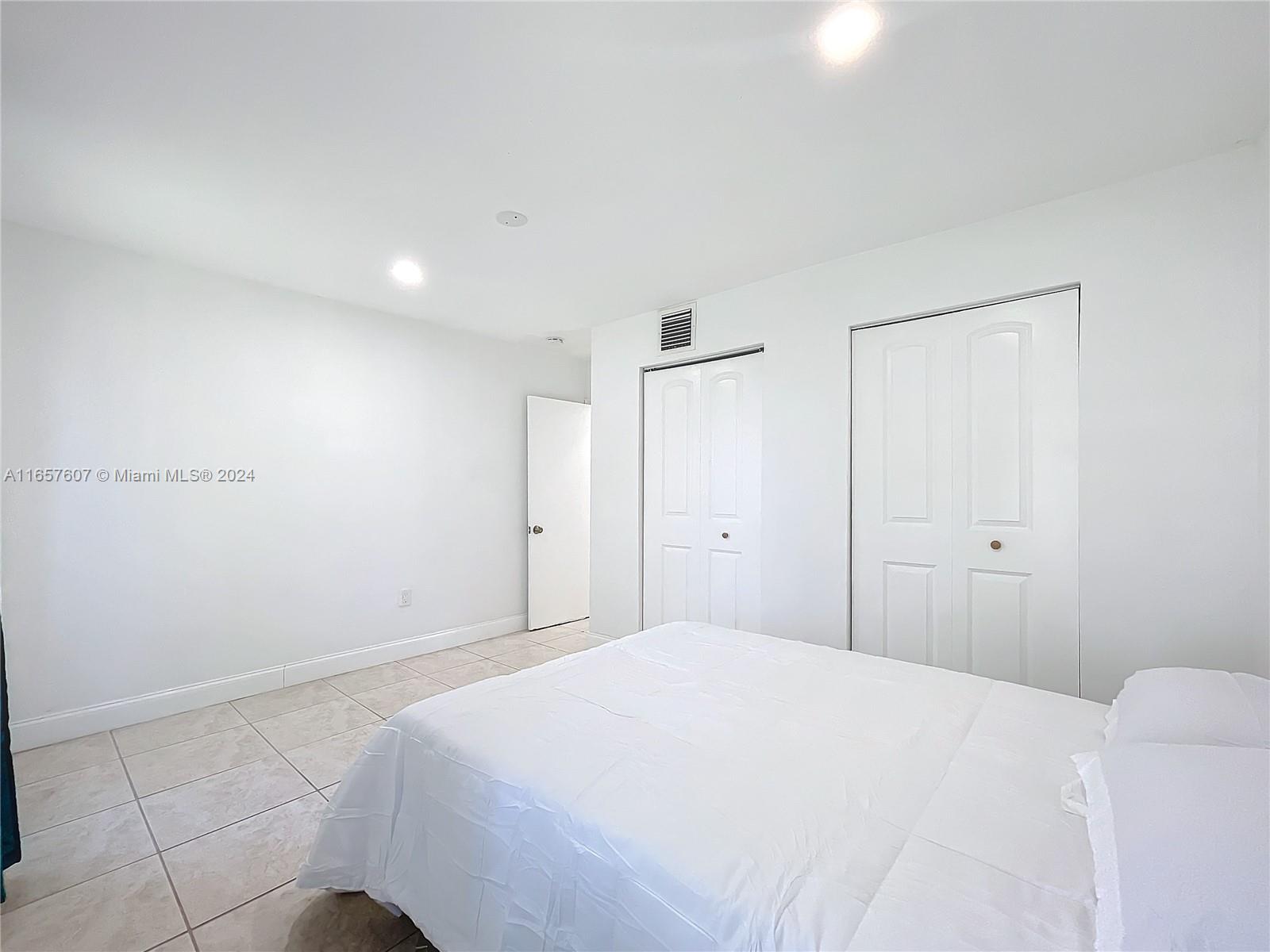 8218 Southampton Drive Miramar, FL 33025 - Photo 22 of 28 a bedroom with a bed and a window