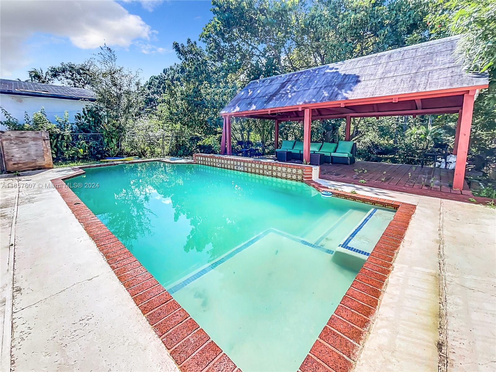 8218 Southampton Drive Miramar, FL 33025 - Photo 27 of 28 a view of swimming pool with a patio