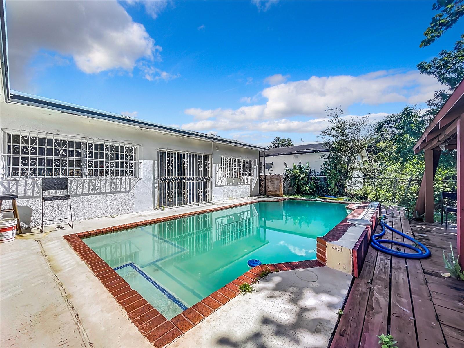 8218 Southampton Drive Miramar, FL 33025 - Photo 28 of 28 a view of a patio with wooden floor and a yard