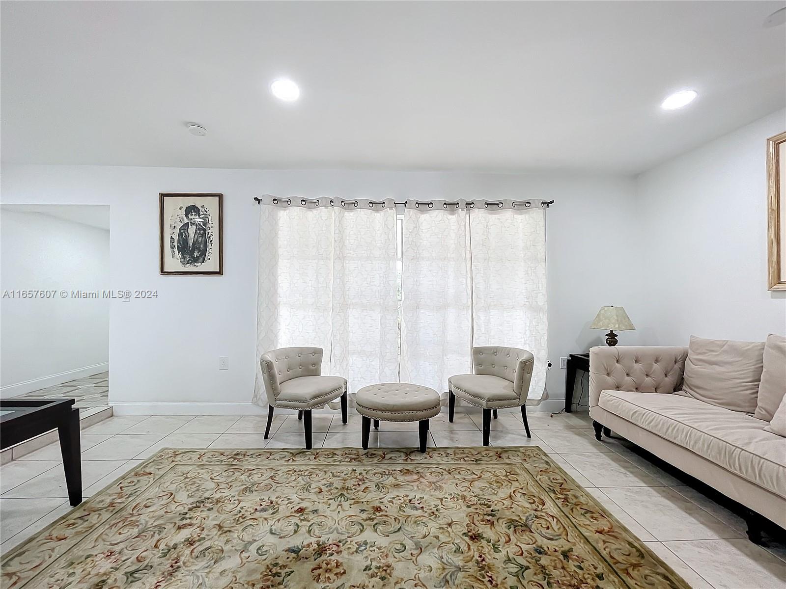 8218 Southampton Drive Miramar, FL 33025 - Photo 6 of 28 a living room with furniture and a rug