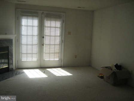 7811 Paddock Way Baltimore, MD 21244 - Photo 13 of 15 a view of an empty room and a window