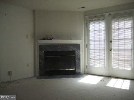 7811 Paddock Way Baltimore, MD 21244 - Photo 14 of 15 a view of an empty room with a fireplace