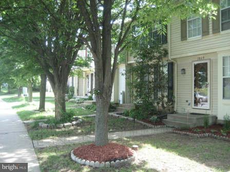 7811 Paddock Way Baltimore, MD 21244 - Photo 3 of 15 a front view of a house with a yard