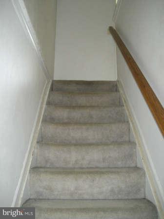 7811 Paddock Way Baltimore, MD 21244 - Photo 8 of 15 a view of staircase with white walls