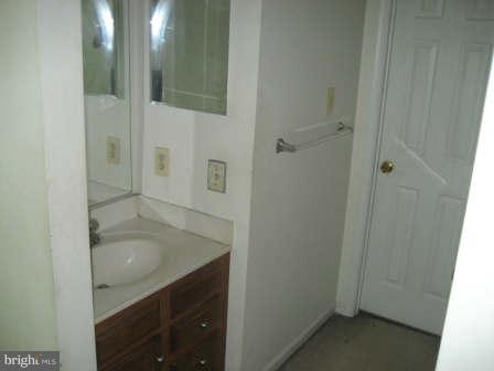 7811 Paddock Way Baltimore, MD 21244 - Photo 10 of 15 a bathroom with a sink and mirror